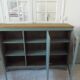 English sideboard, shallow, smoky green, wooden top.