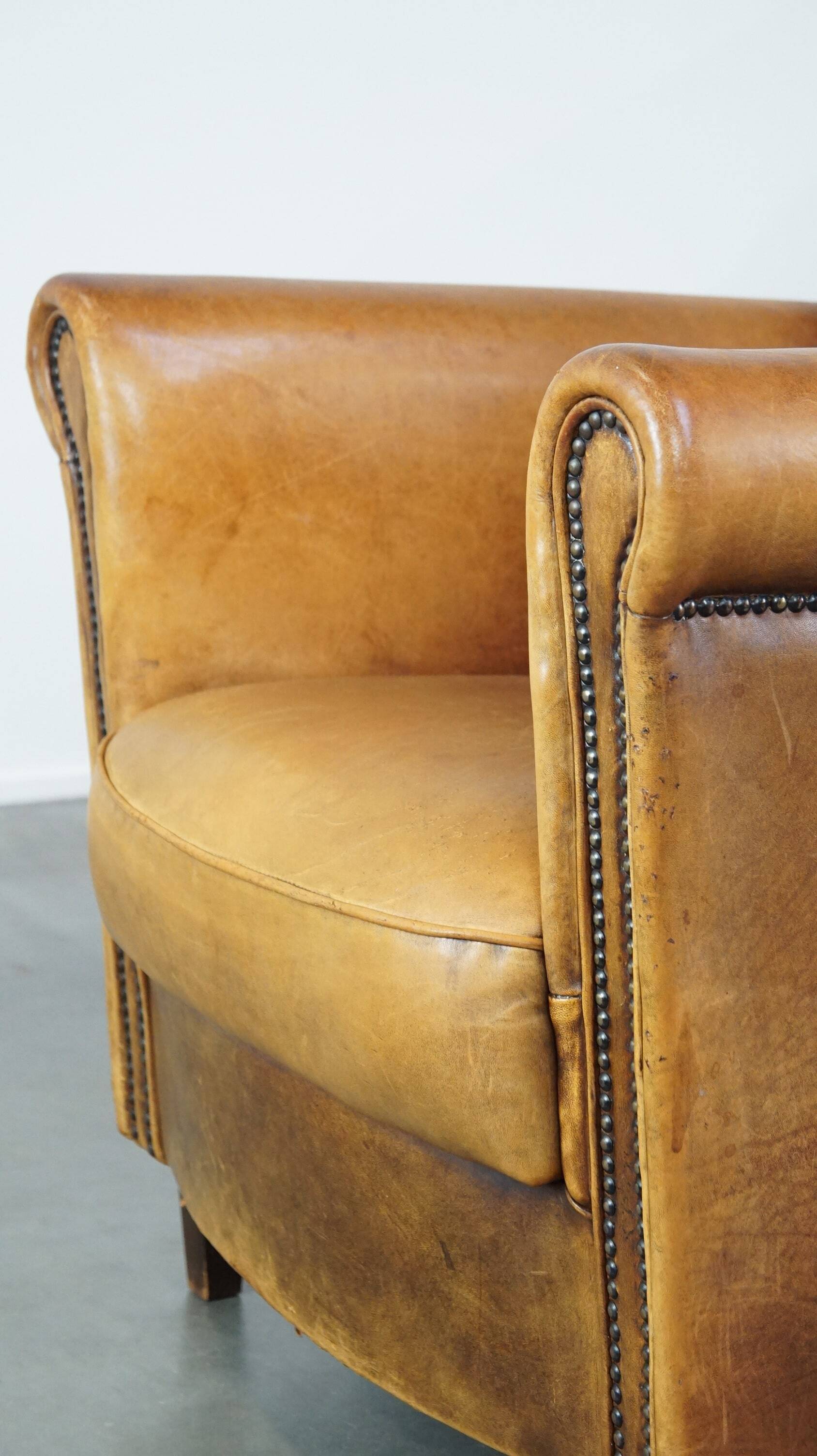 Stately, sleekly finished, comfortable sheepskin armchair
