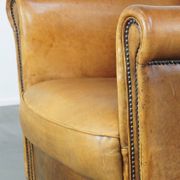 Stately, sleekly finished, comfortable sheepskin armchair