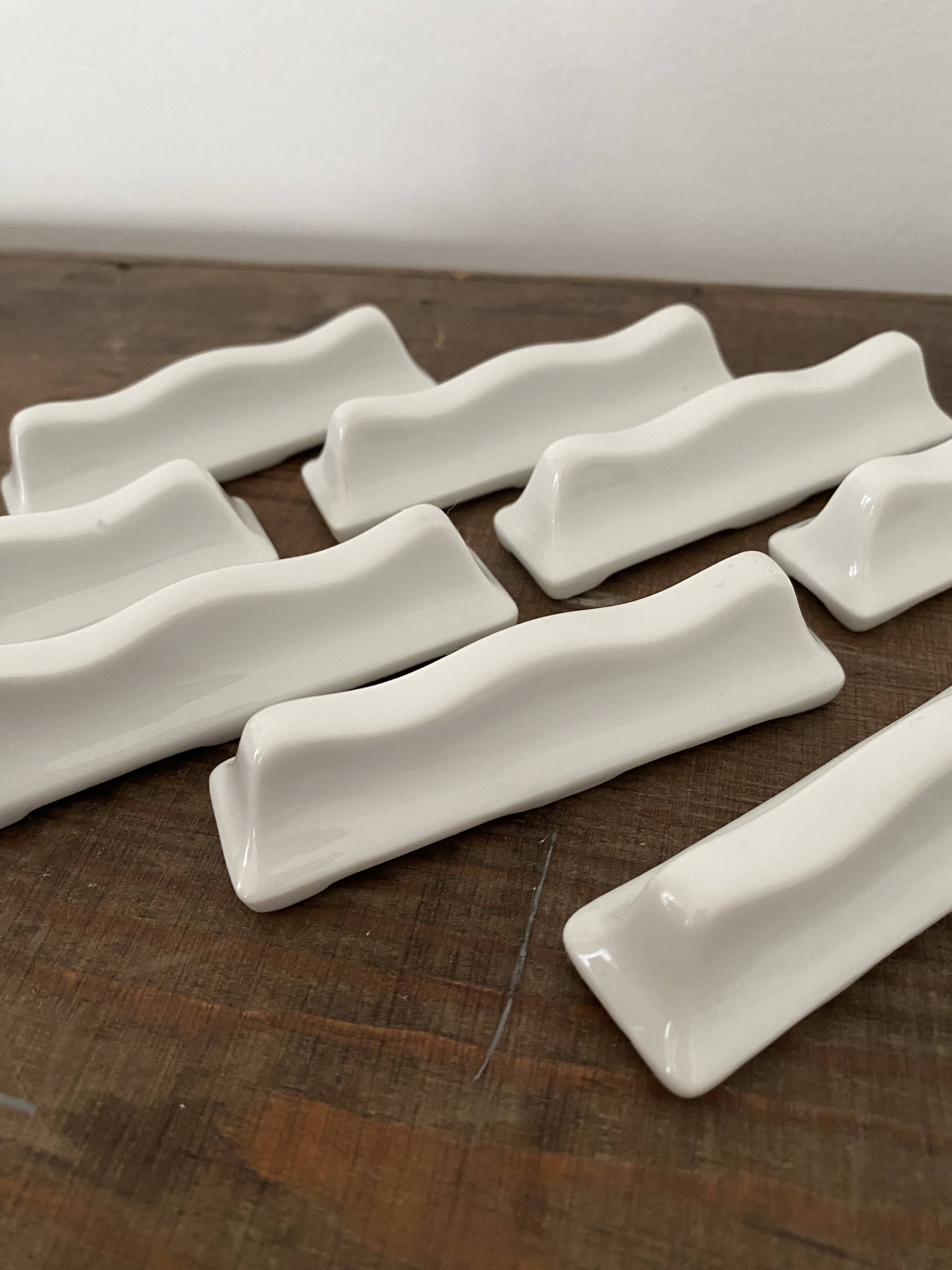 Vintage knife holders of 12, in white wave-shaped porcelain