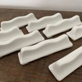 Vintage knife holders of 12, in white wave-shaped porcelain