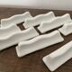 Vintage knife holders of 12, in white wave-shaped porcelain