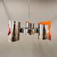 Hanging lamp in chromed metal with orange contrast lacquer and three light sources.