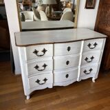 Patinated crossbow chest of drawers.