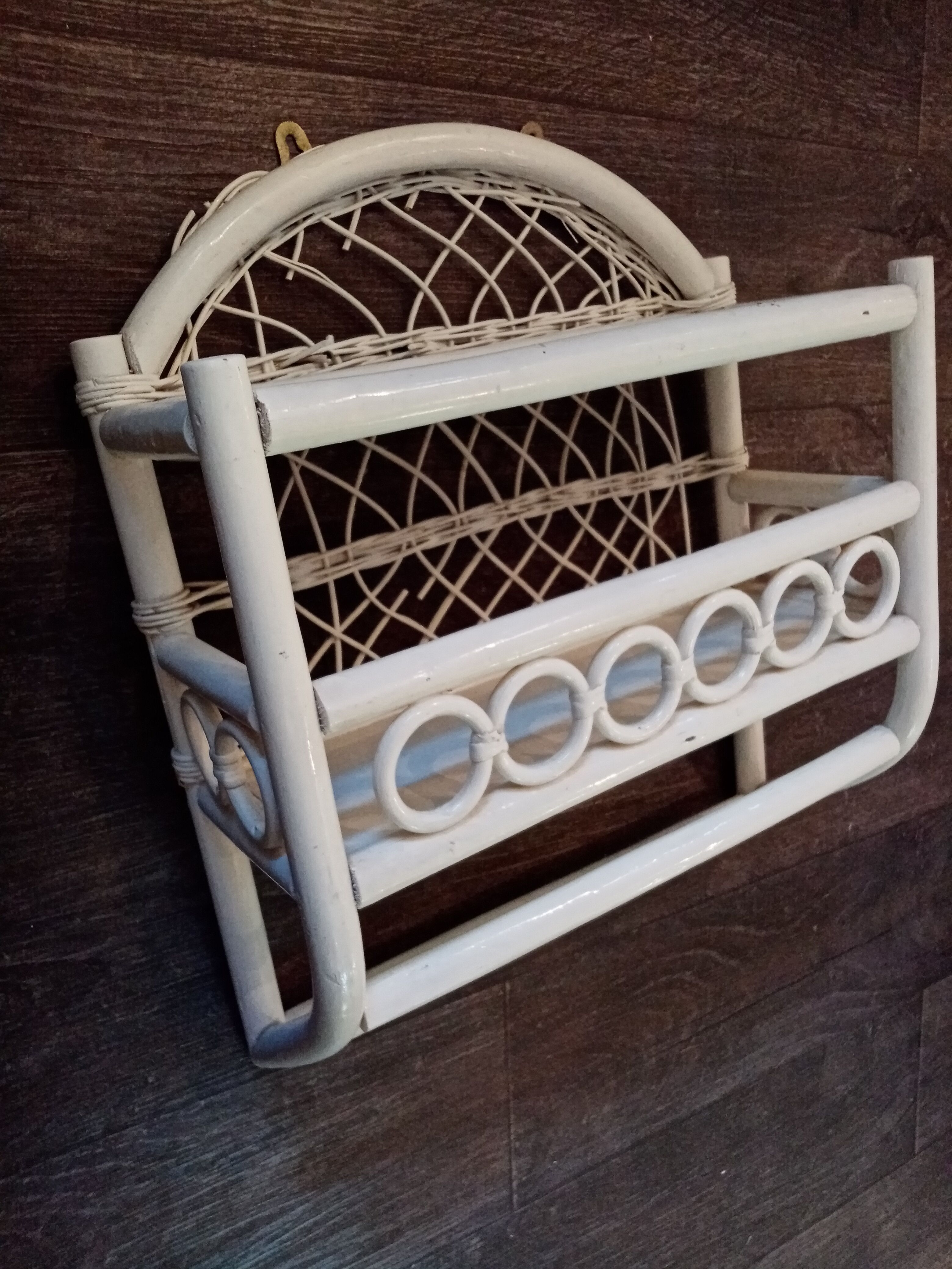 White rattan wall shelf