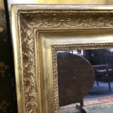 Miroir Empire à palmettes feuille d’or restauré