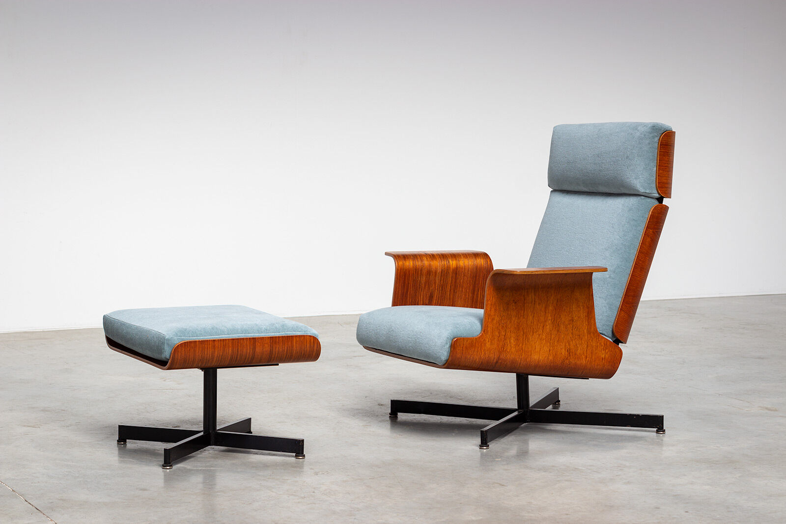 Pair of modernist teak lounge chairs and poufs 1960