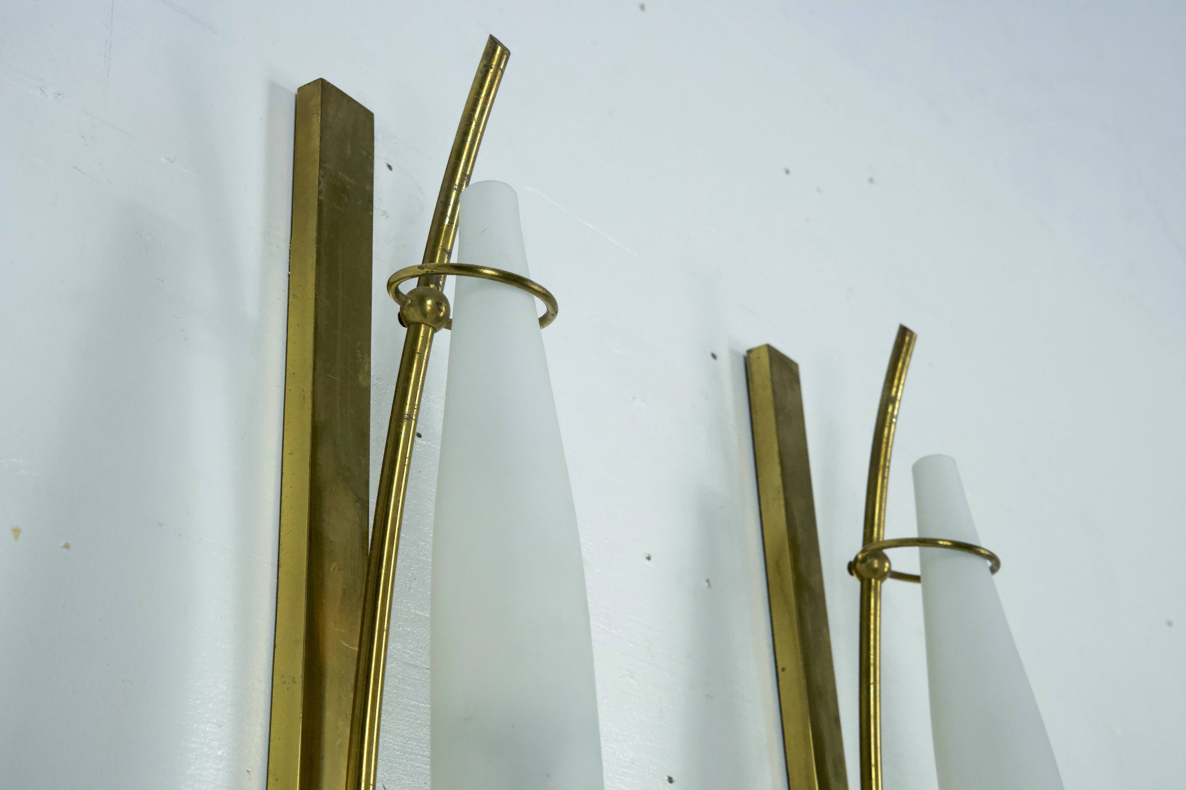 Set of three sconces in brass and triplex opaline glass. Italy 1950s