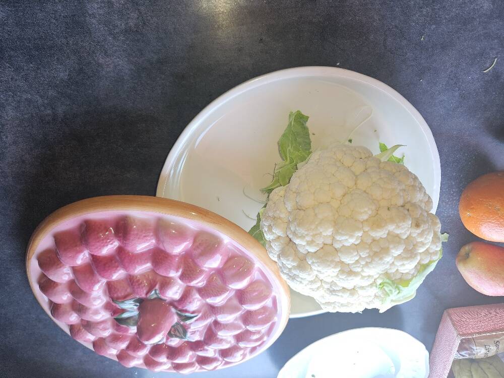 Glazed ceramic dessert plate with strawberry design.