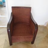 Vintage colonial-style armchair in woven rattan and exotic wood