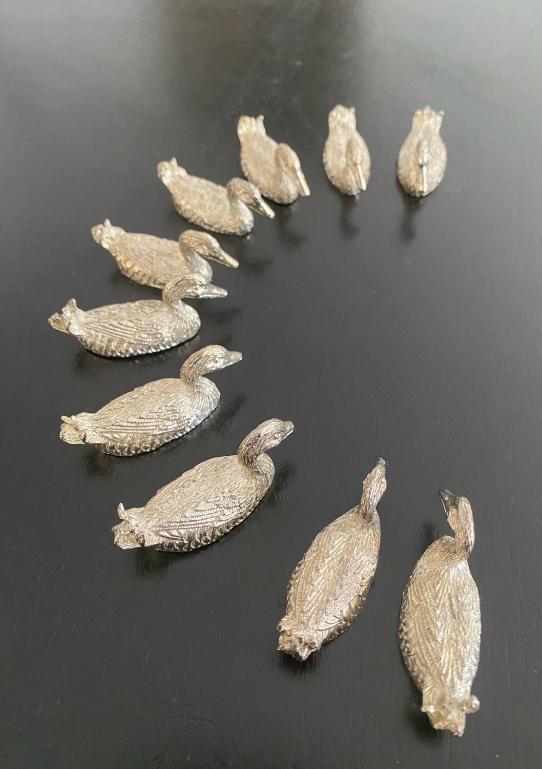 10 duck-shaped knife holders in silver-colored metal
