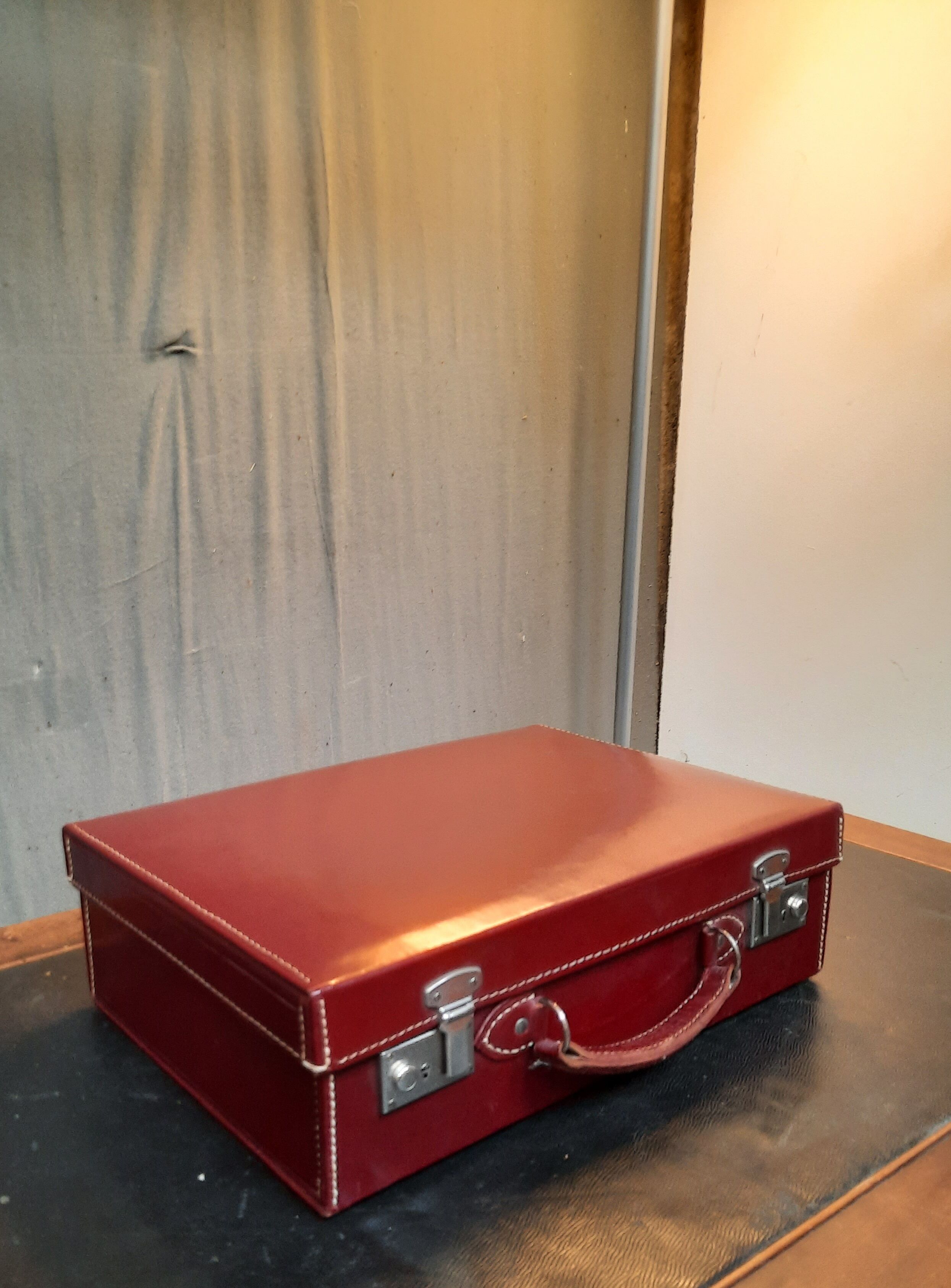 Red leather suitcase