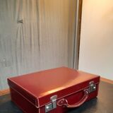 Red leather suitcase