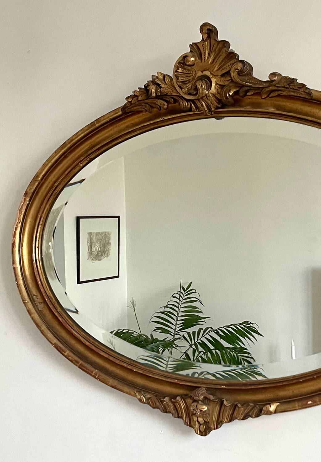 Antique oval gilt mirror.
