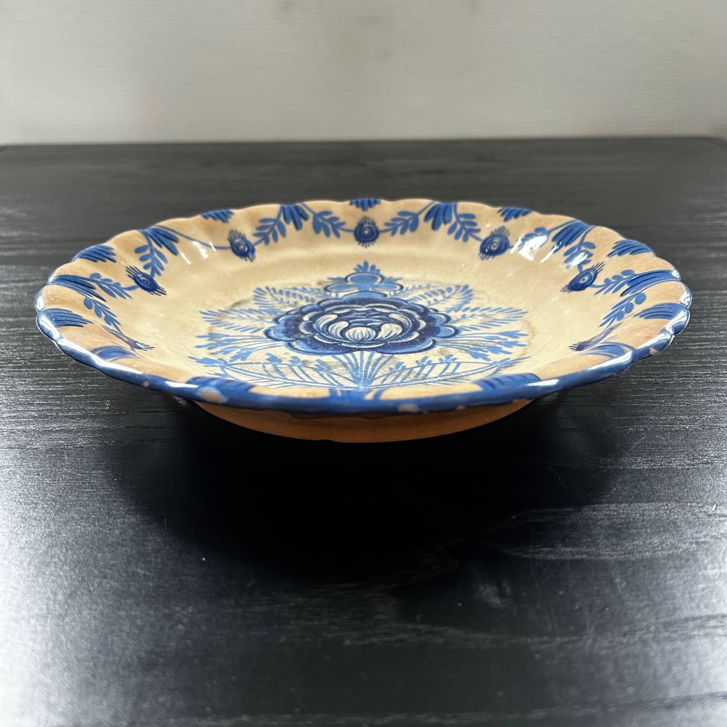 Old dish with blue floral decoration