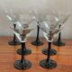 7 thin black stemmed glasses