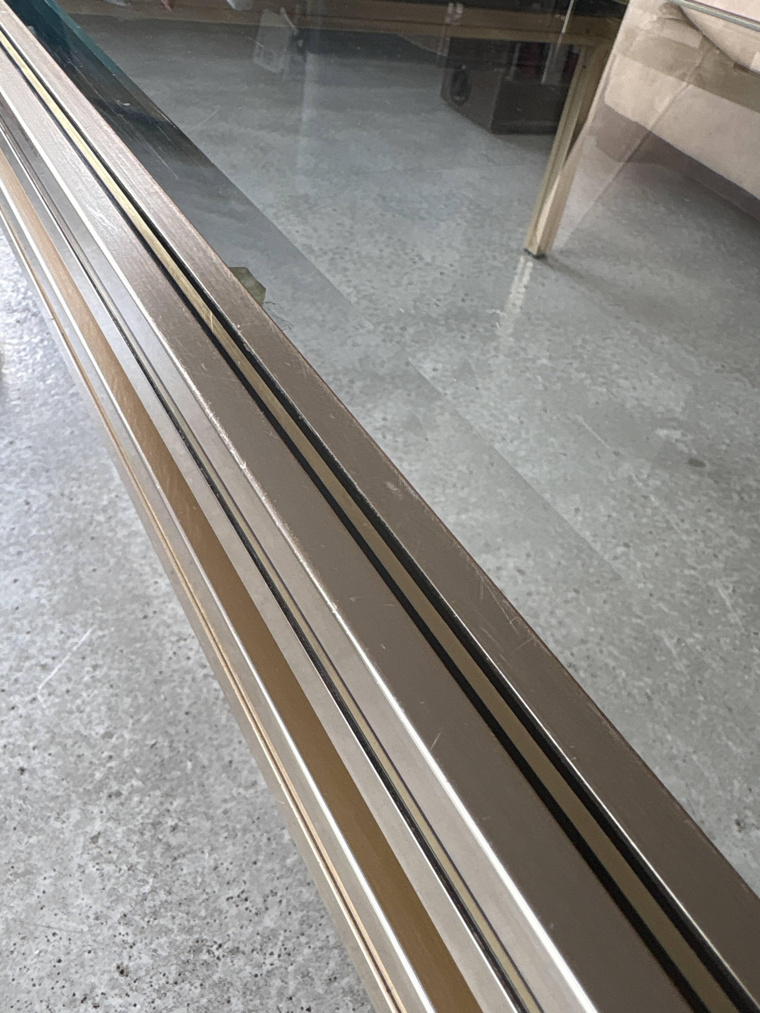 Brass/glass table designed by Pierre Vandel Paris