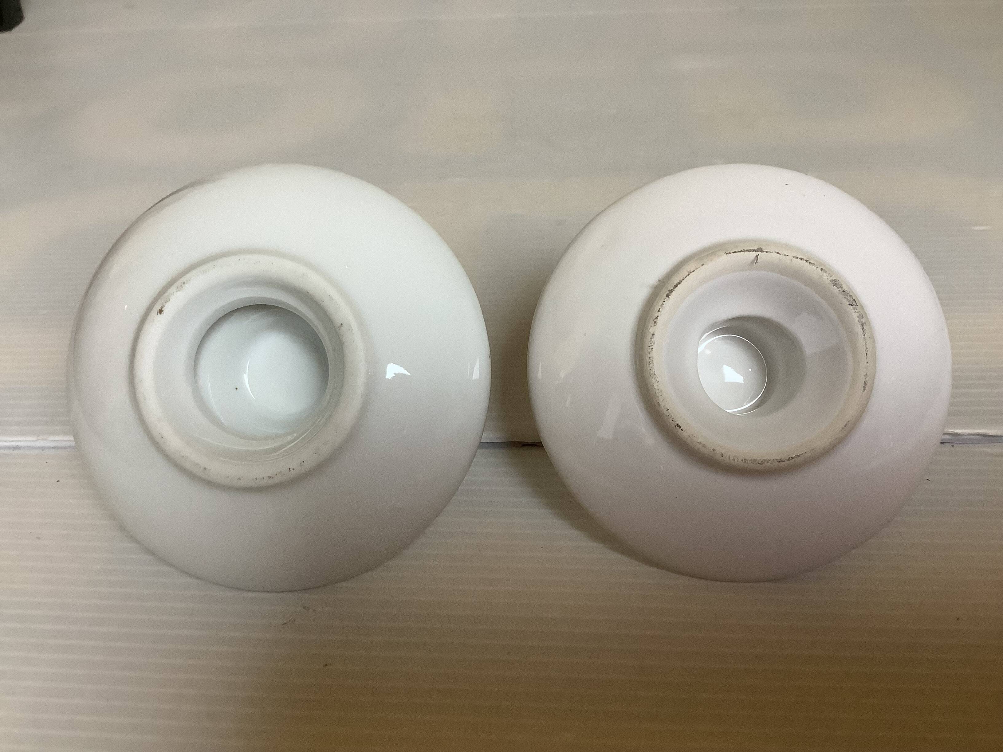 Pair of small white cellar rat candlesticks