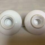 Pair of small white cellar rat candlesticks