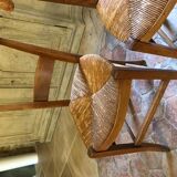 Solid oak table with 3 extension cords, 6 oak chairs with straw seat
