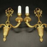 Paire d'appliques au noeud style Louis XVI - bronze