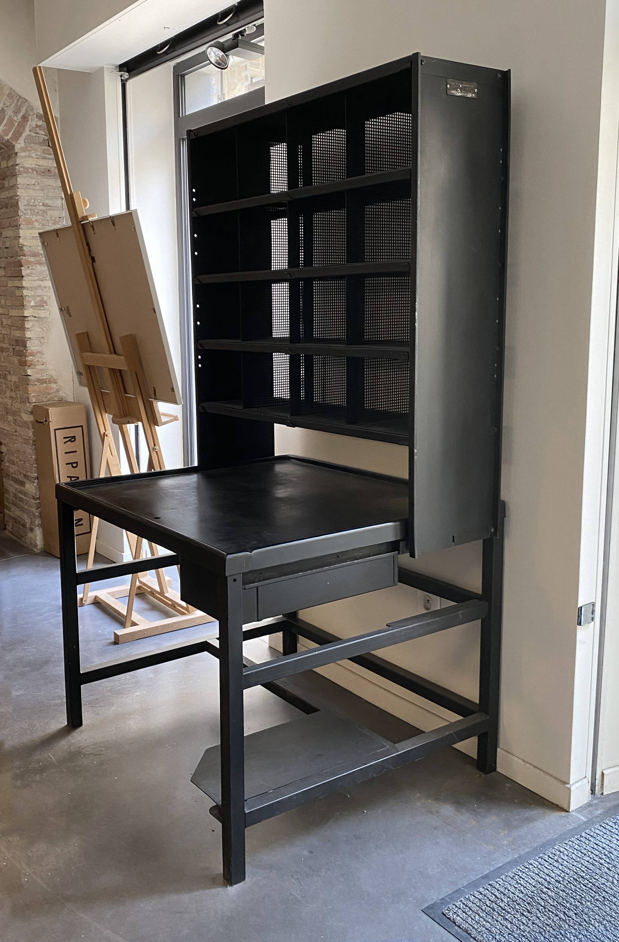 Postal sorting desk with a sliding top part back and forth.