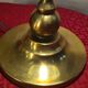 brass lamp with green stained glass shade.