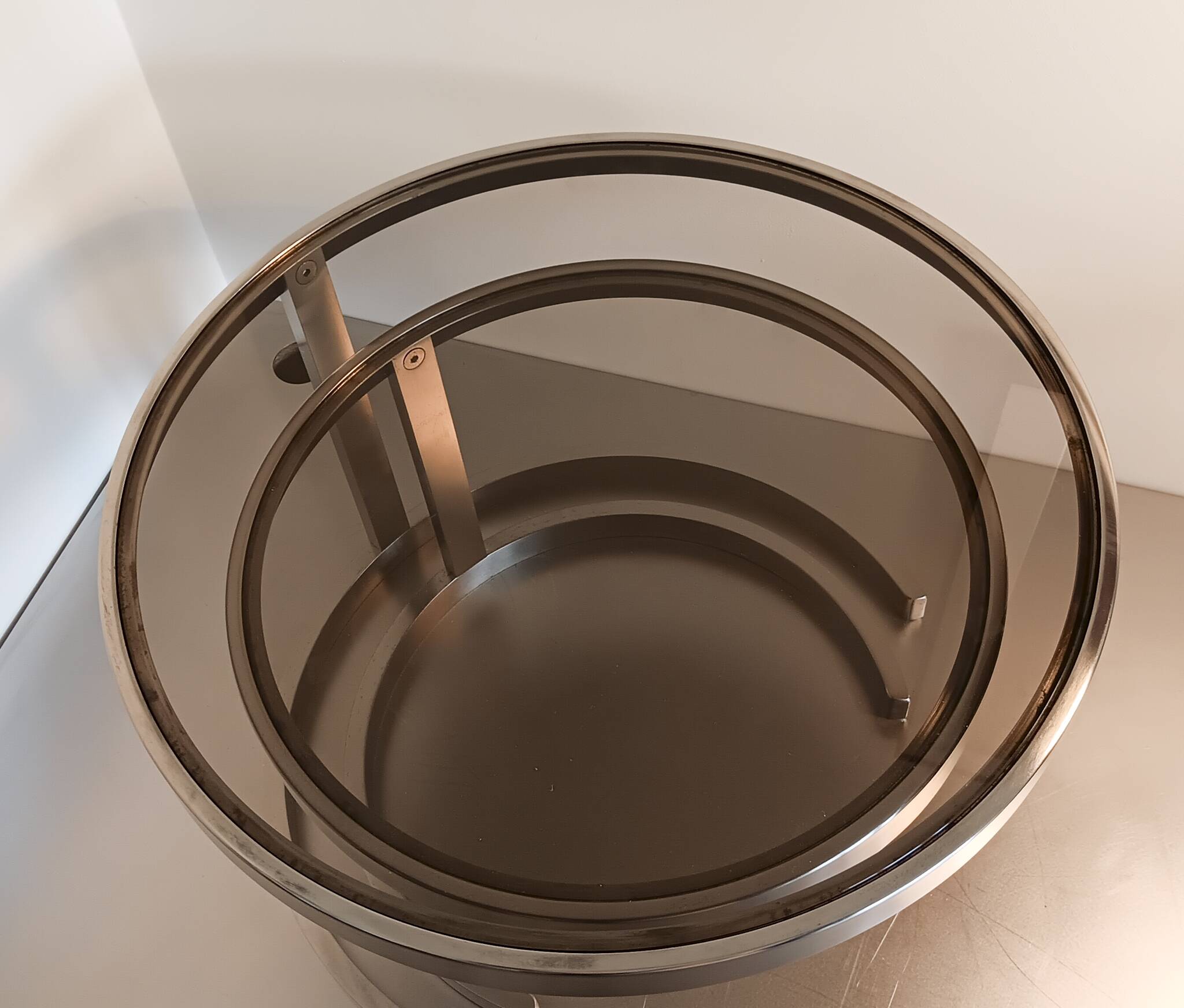 2 vintage 1970s smoked glass and brushed metal nesting coffee tables