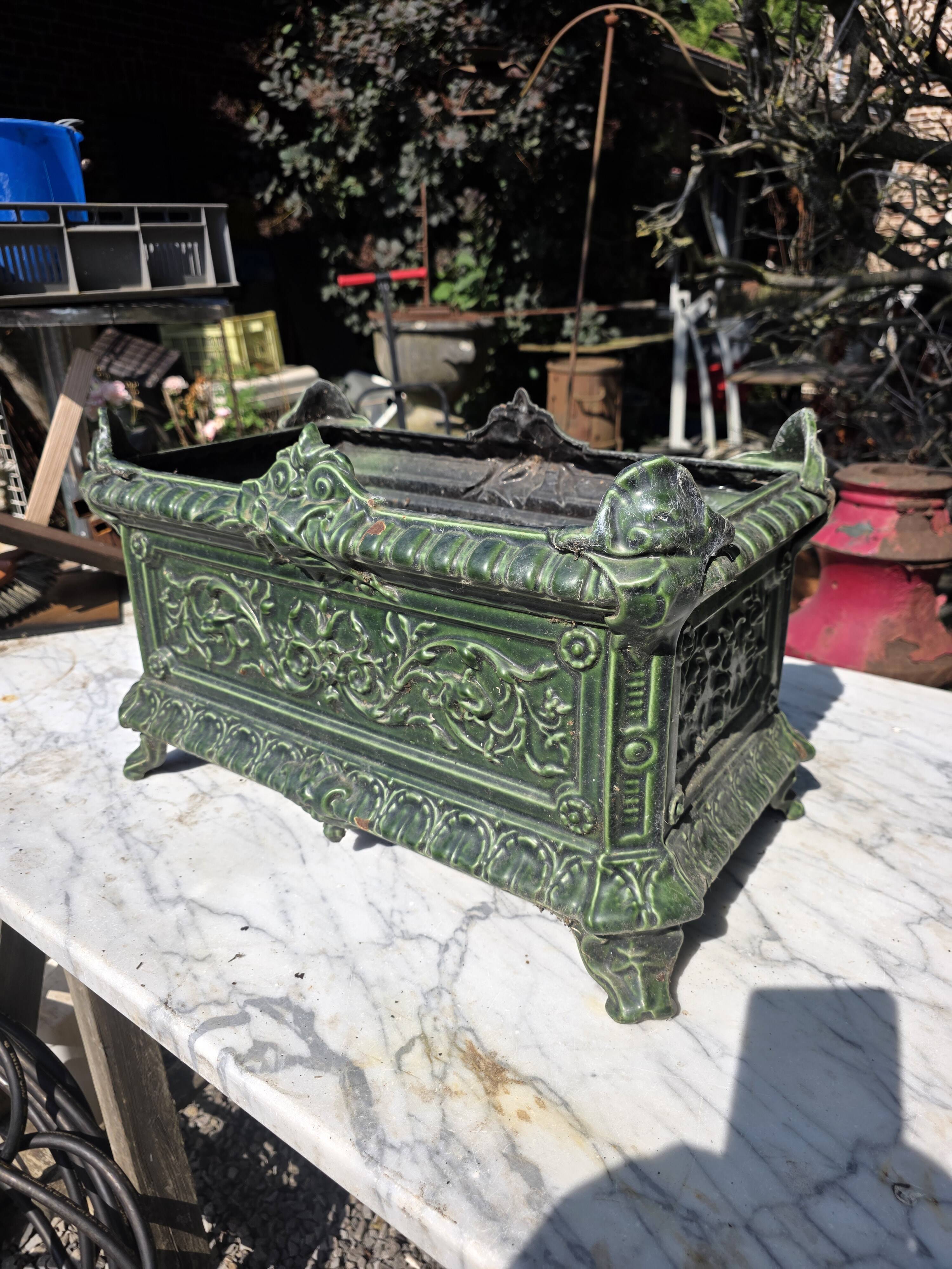 Antique enamelled cast iron planter in the Napoleon III style.