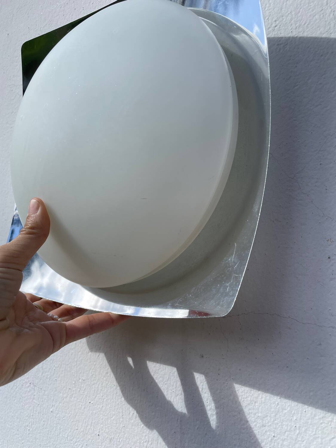 White glass and stainless steel ceiling light