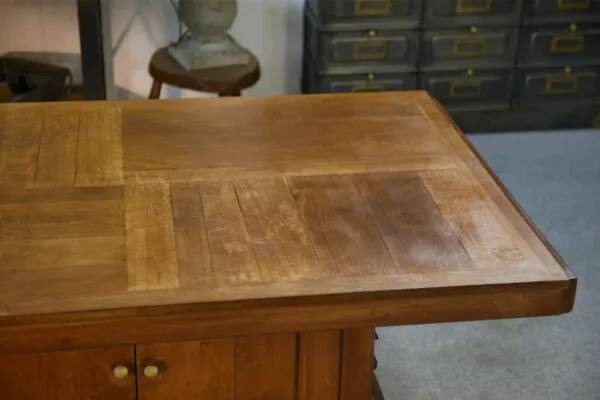 Solid oak table with central pedestal base and storage, Charles Dudouyt, 1950s