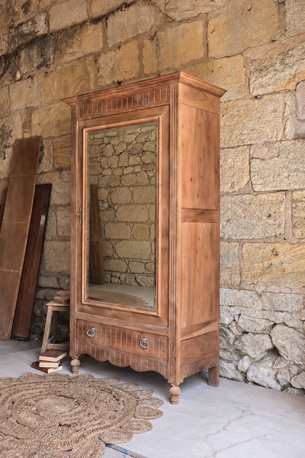 Antique walnut bonnetière with bevelled mirror.