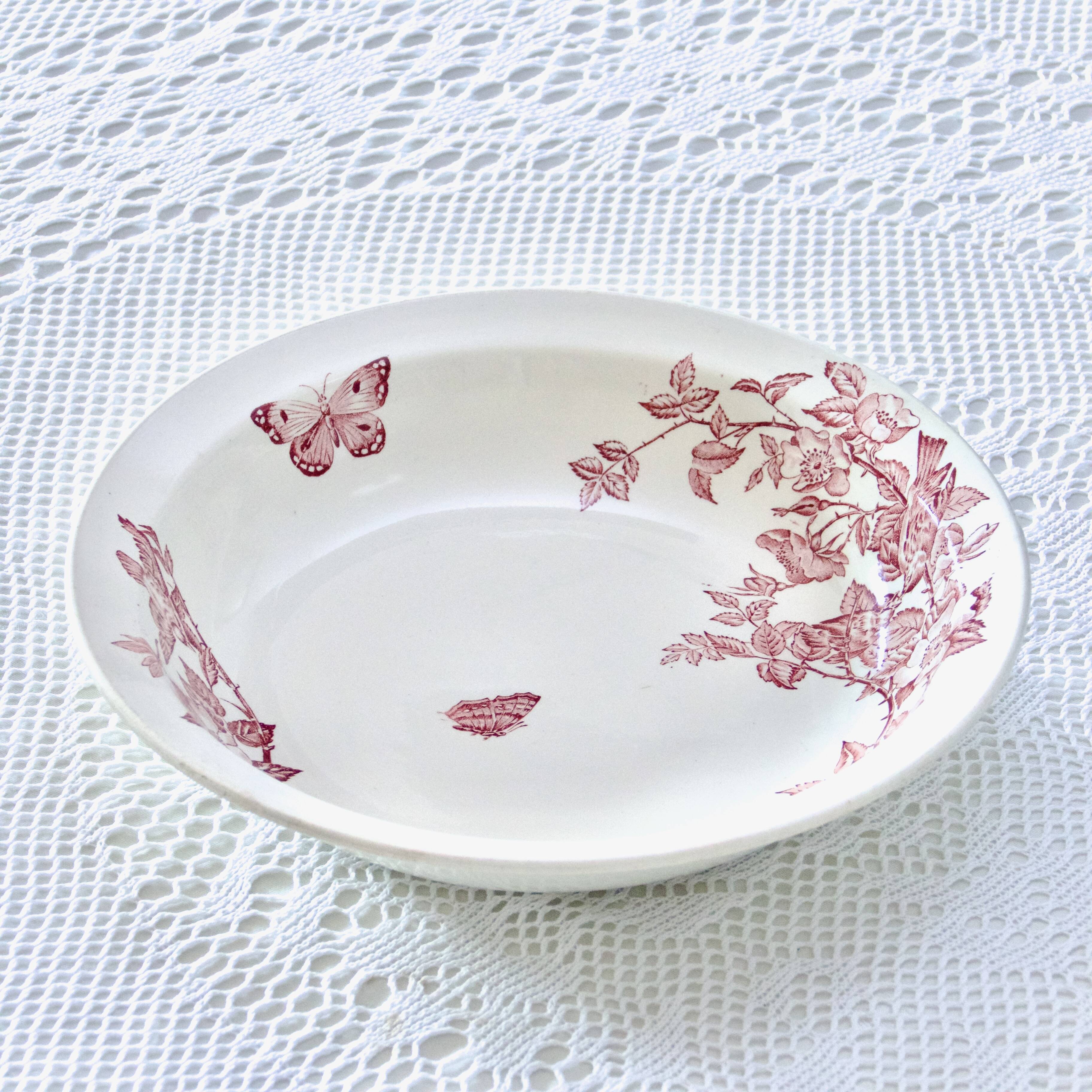 Large 19th century pink ironstone salad bowl with birds, dragonfly and butterflies, Badonviller