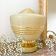 Old globe table lamp in beige and gold glass
