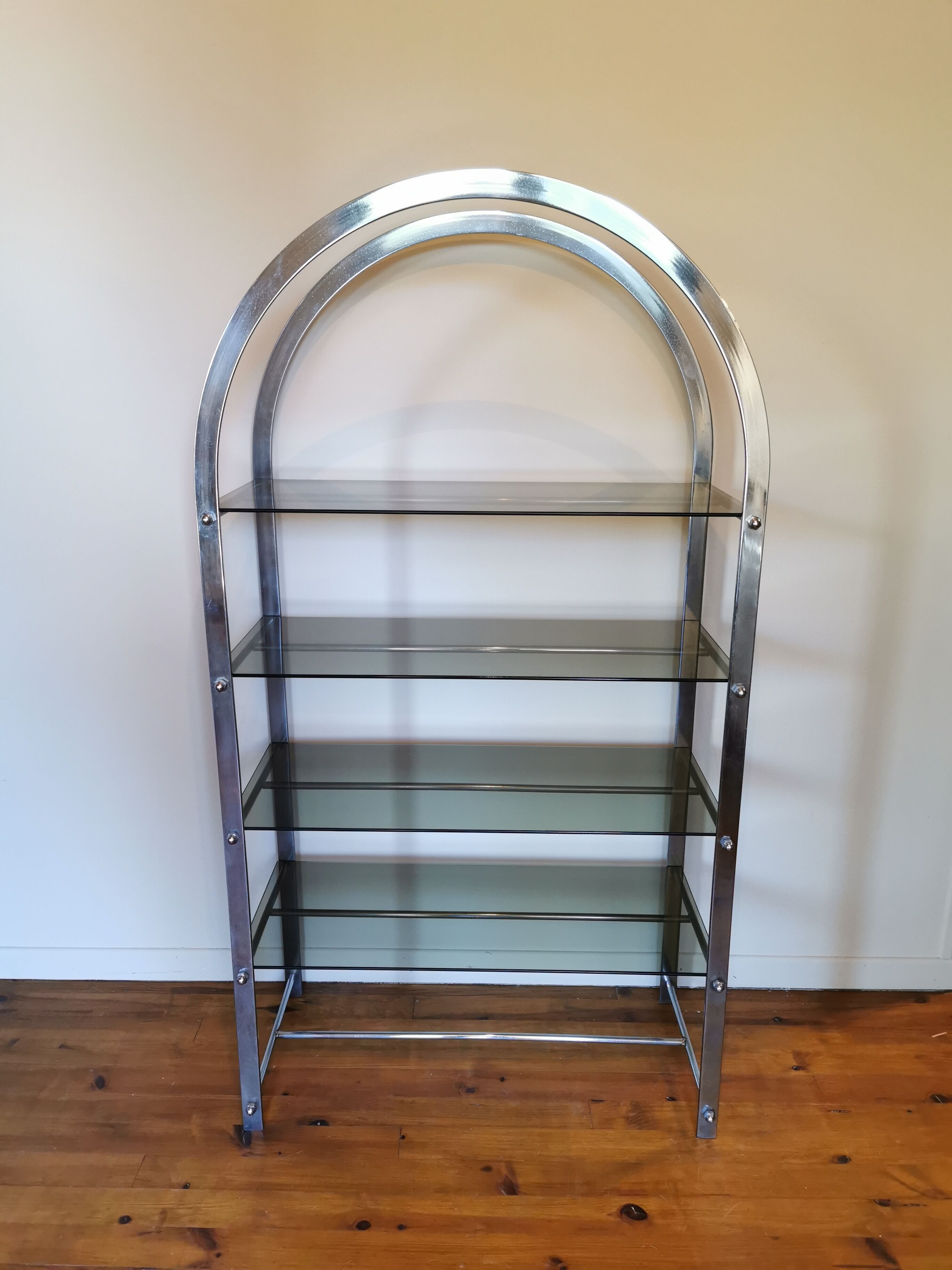 Rounded shelf from the 70s in chrome metal and glass