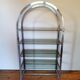 Rounded shelf from the 70s in chrome metal and glass