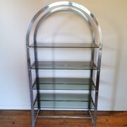 Rounded shelf from the 70s in chrome metal and glass