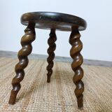 Wooden tripod stool with twisted legs