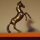 Golden bronze horse