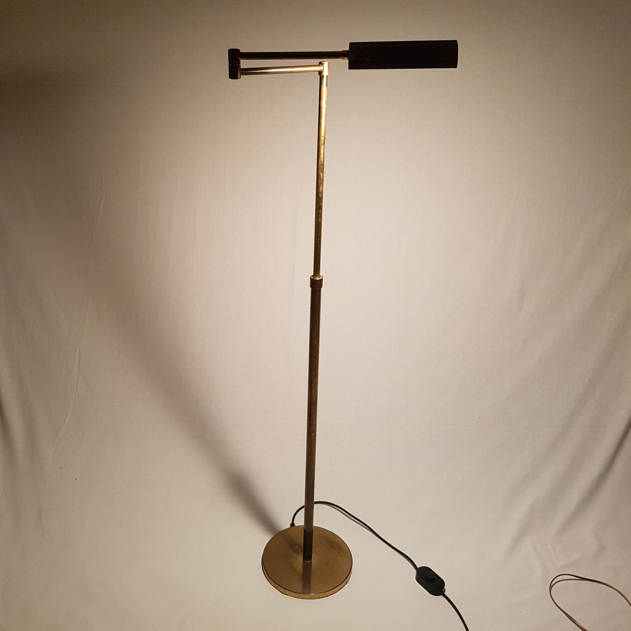 Articulated brass floor lamp