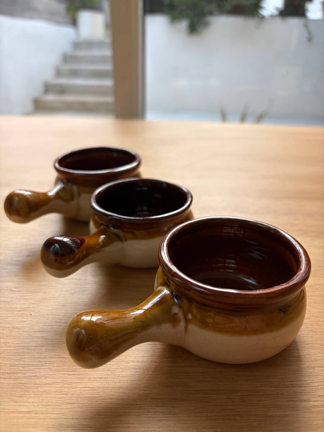 Set of 3 small glazed stoneware ramekins.