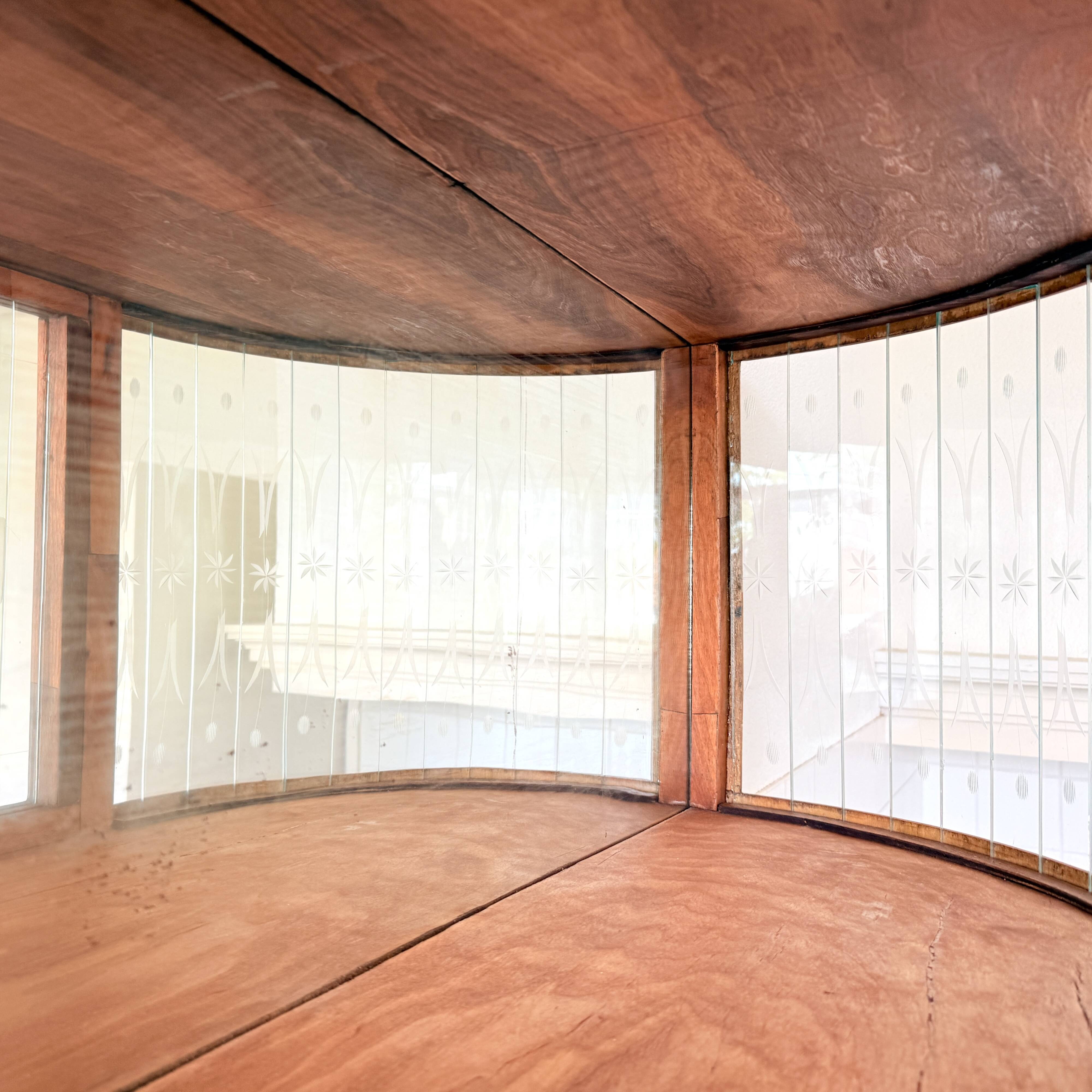 Art Deco-style wall-mounted display cabinet with floral engraving