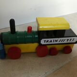 Small vintage train in multicolored wood