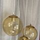 Suspension cascade with 3 globes of vintage golden yellow bubbles from the 1970s.