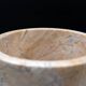 Cylindrical marble vase with fossil motif