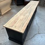 Old workshop furniture transformed into a TV unit.