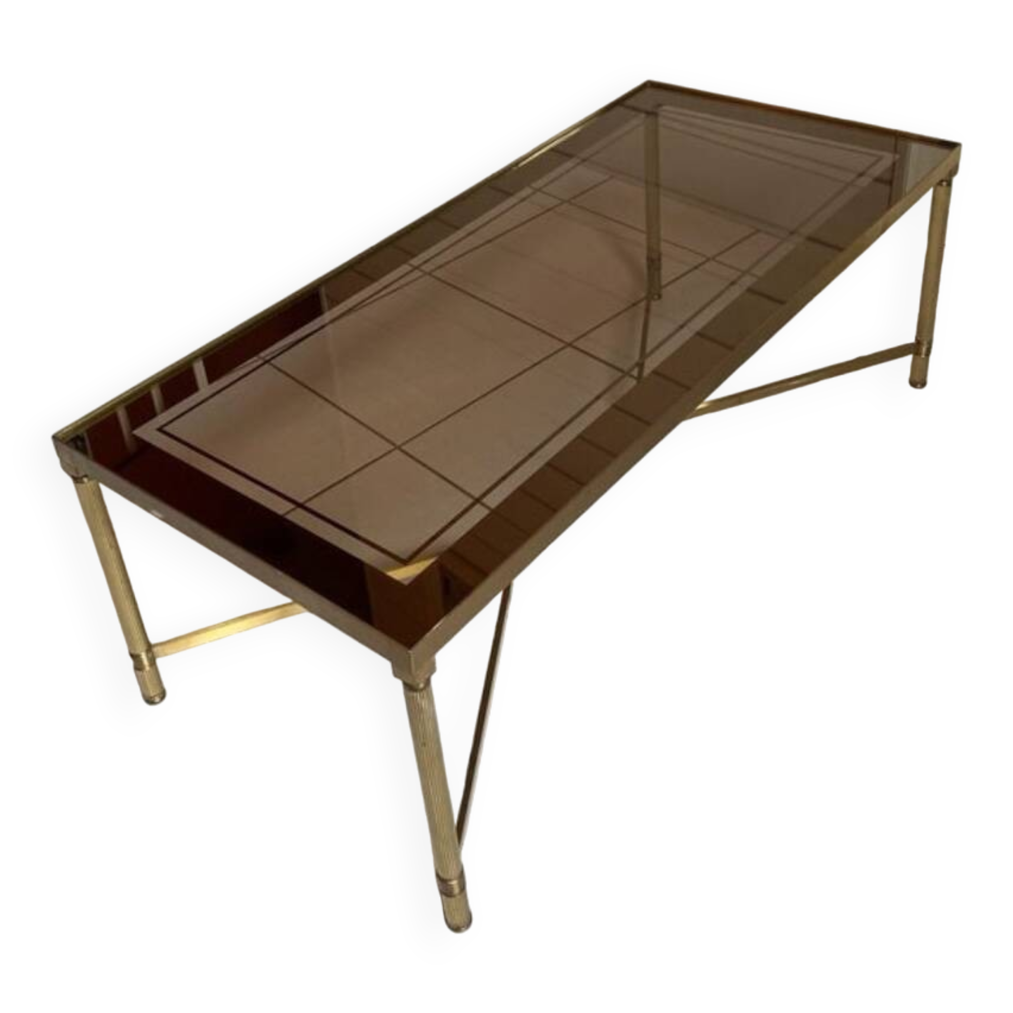 Rectangular neoclassical coffee table in gilded brass with a glass top.