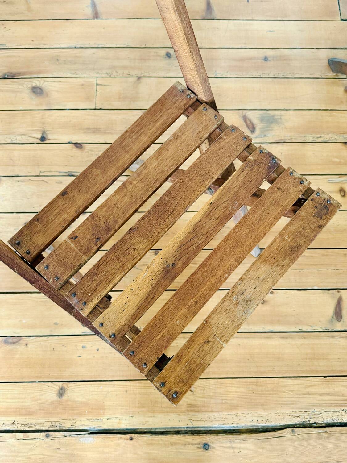 Two vintage wooden folding chairs, circa 1960