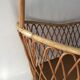 Vintage rattan cradle with its spire