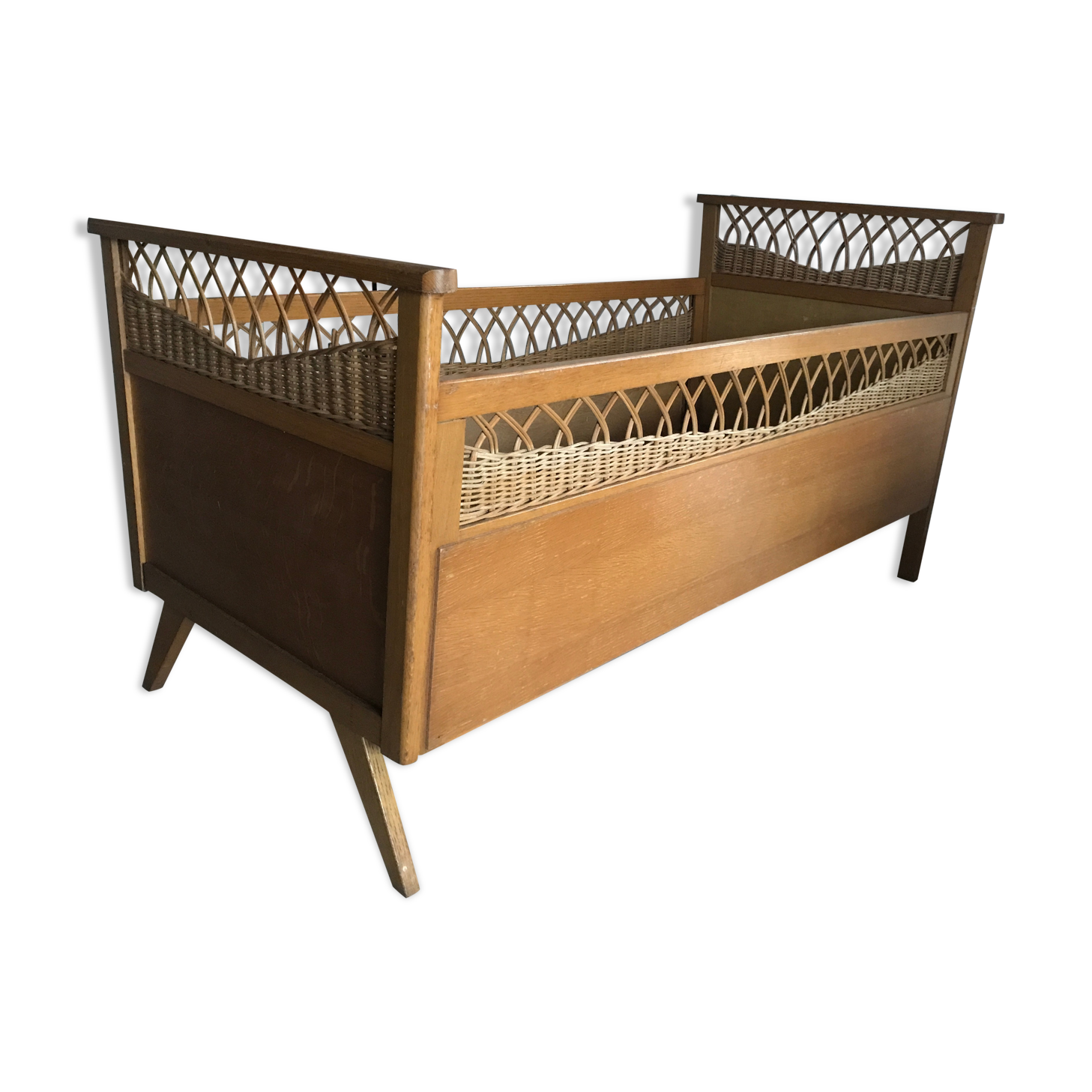 Rattan baby bed and vintage wood